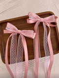 Set de 2 lazos rosados con encaje
