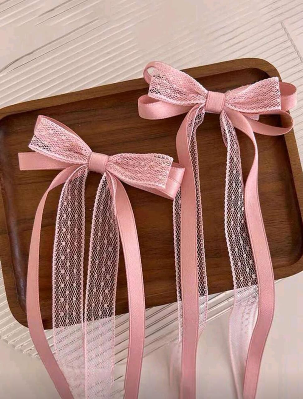 Set de 2 lazos rosados con encaje