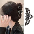Pinza para el cabello negra con diseño de araña