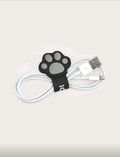 Organizador de cables pata de gato negro