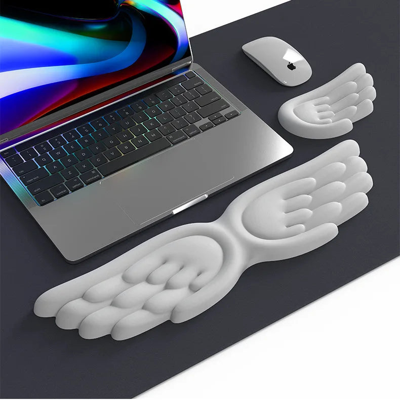 Alfombrilla ergonómica para teclado con alas de ángel
