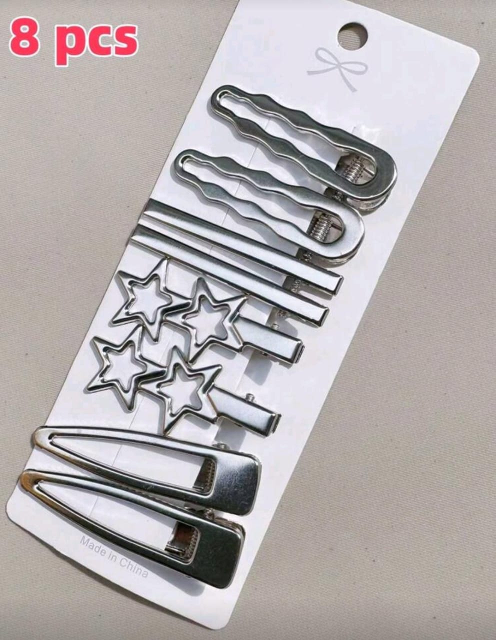 Set de 8 pinzas plateadas para el cabello