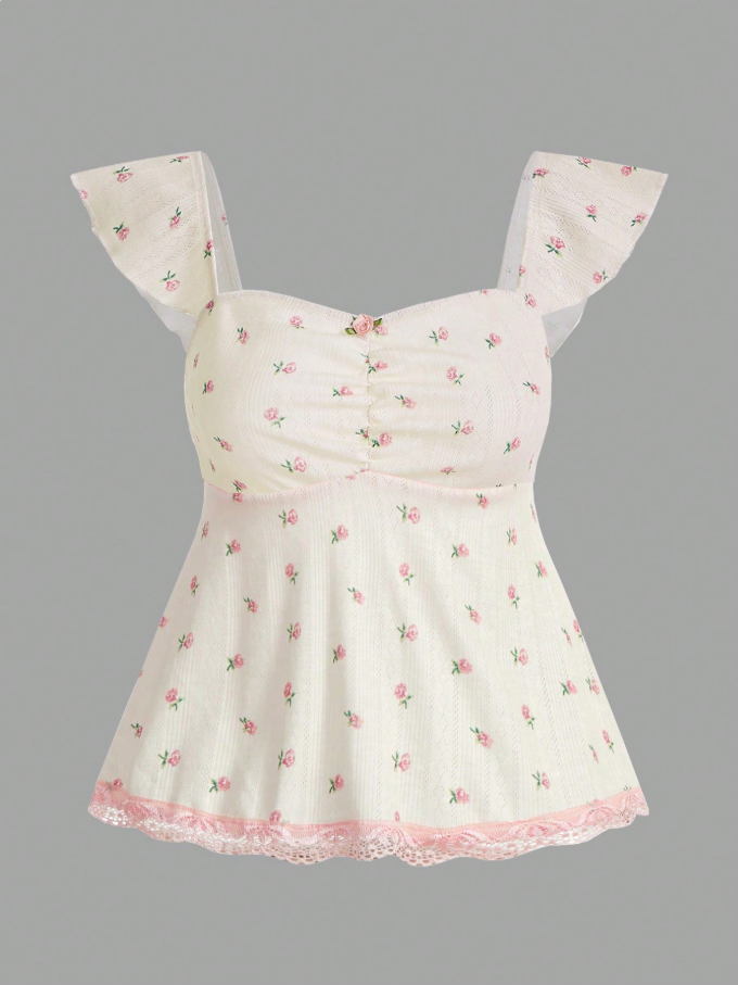 Blusa color pastel con detalles flores y encaje rosa