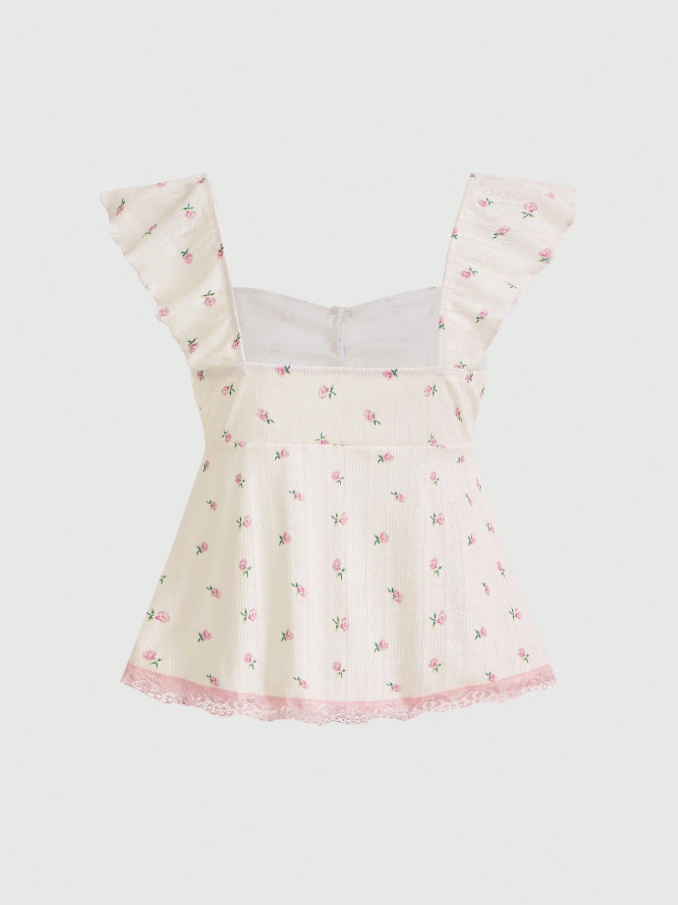 Blusa color pastel con detalles flores y encaje rosa