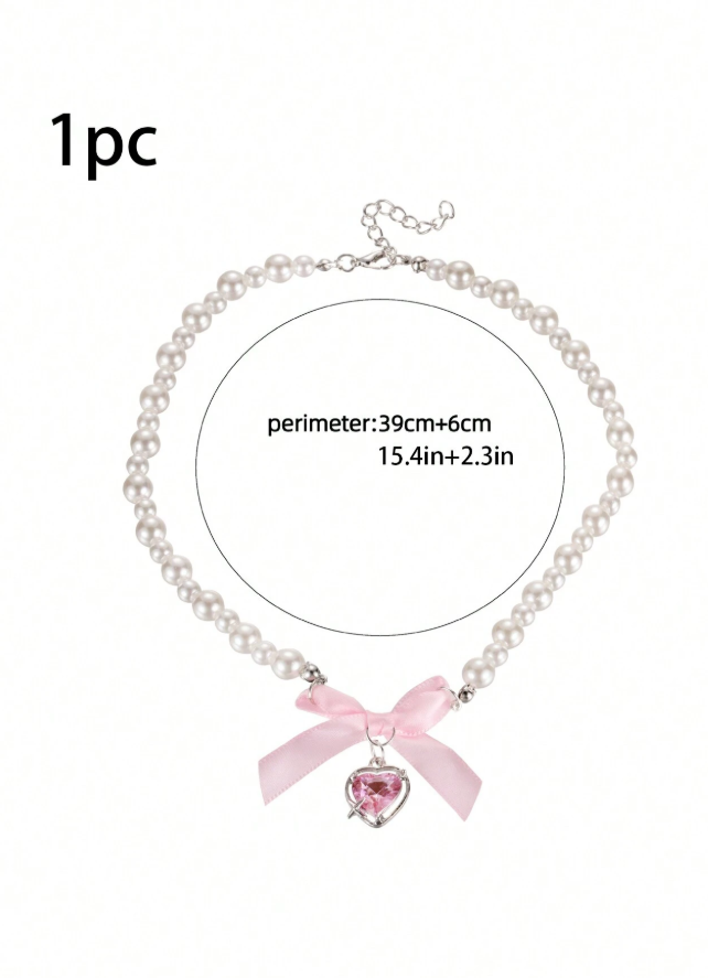 Collar de perlas con lazo y dije de corazón