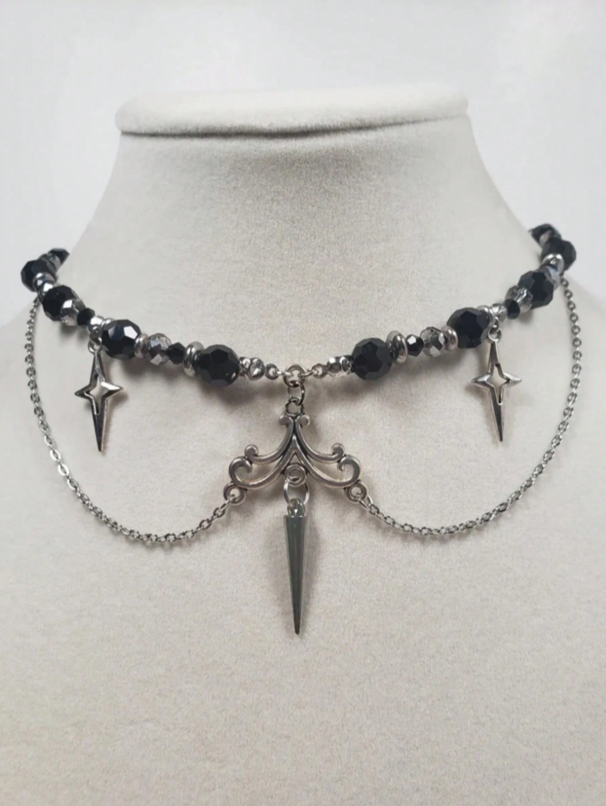 Colgante perlas negras y estrellas