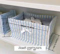 Cesta de almacenamiento rosada con lazos blancos