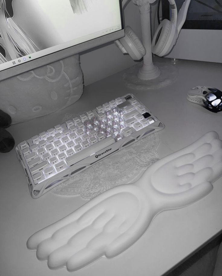 Alfombrilla ergonómica para teclado con alas de ángel