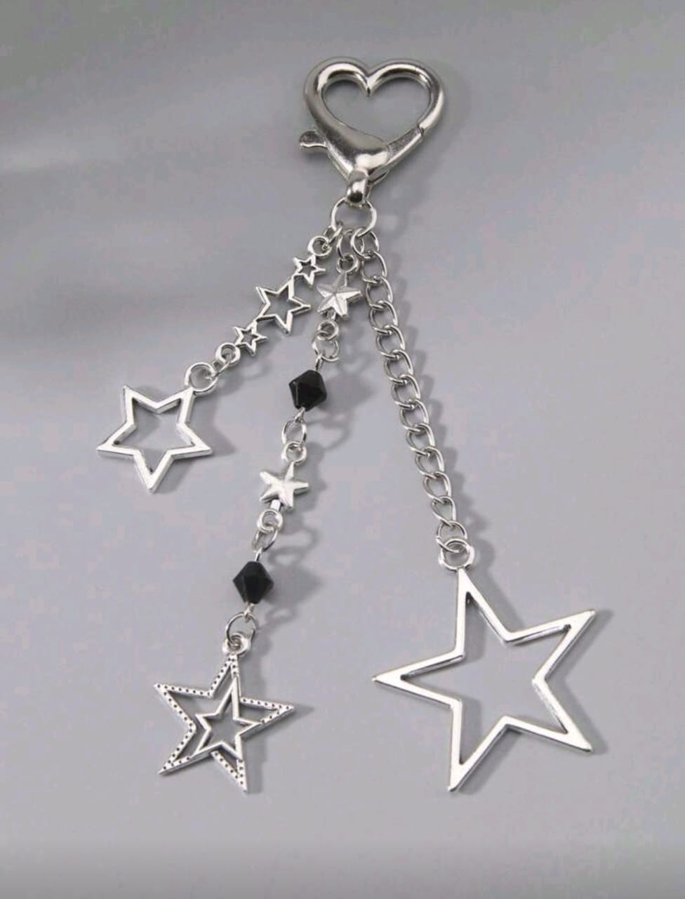 Llavero plateado de estrellas